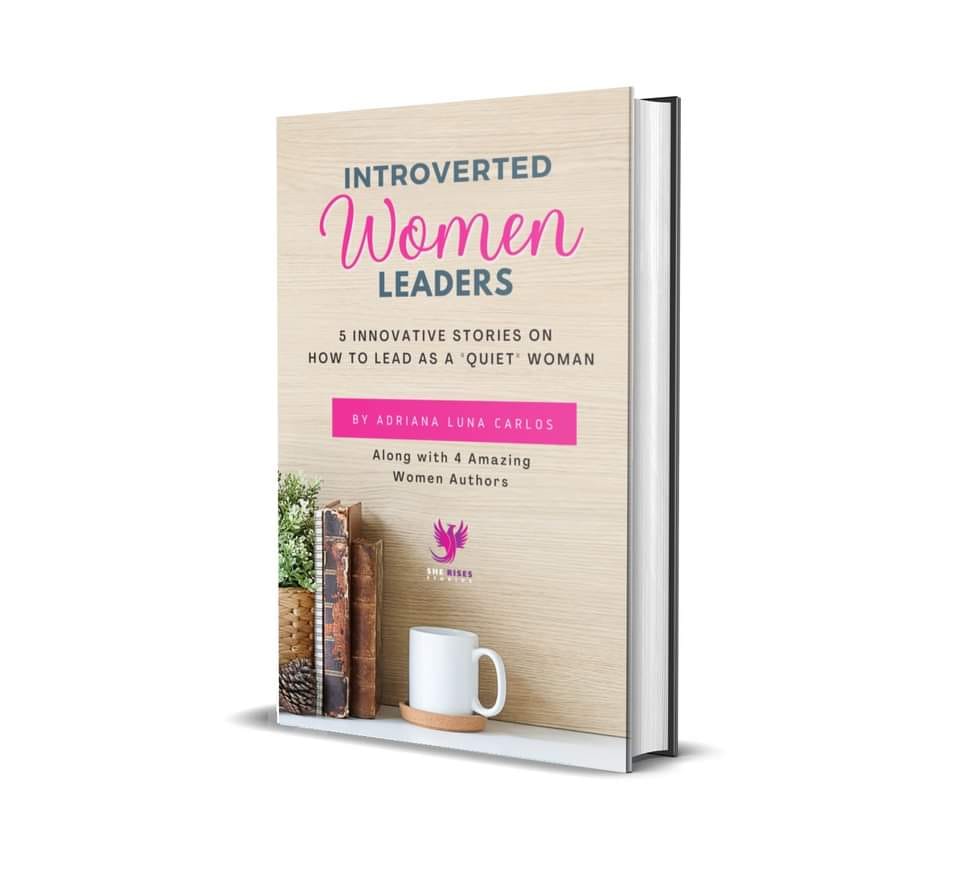 Virtual Work Wife - 3D book cover of "Introverted Women Leaders" by Adriana Luna Carlos, featuring a wooden shelf with books, a white mug, and a nod to Michelle Bell Author's inspiring works.